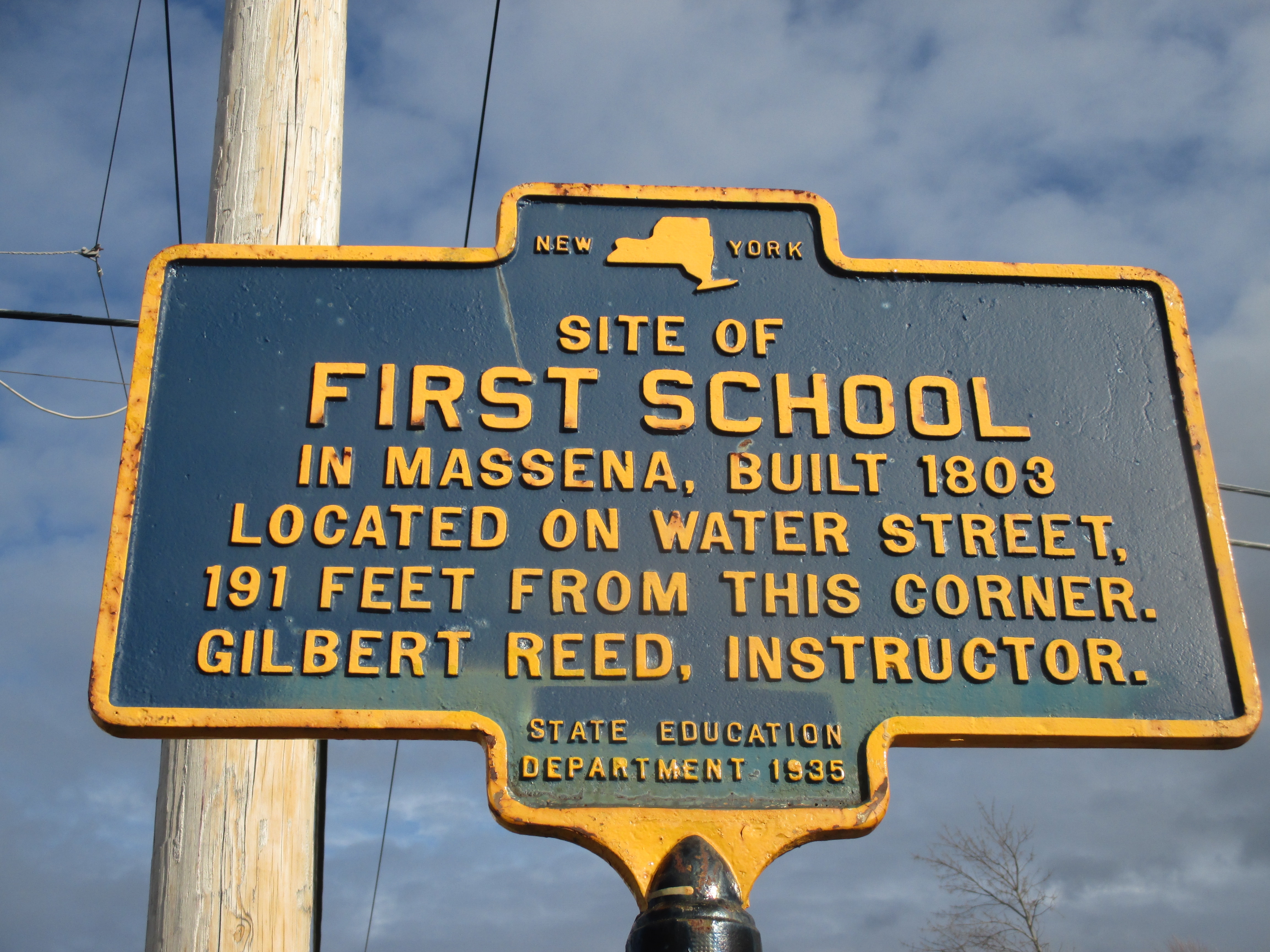 Site of First School in Massena Marker