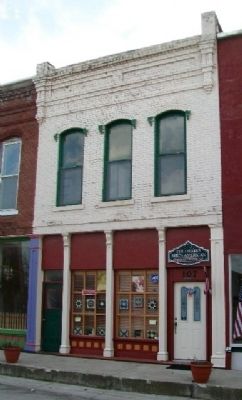 First Permanent Home of Bank of Ash Grove, Mo and Marker. Click for full size. First Permanent Home of Bank of Ash Grove, Mo and Marker image. Click for full size.