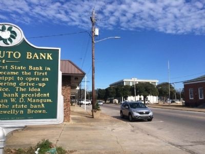 View of marker looking north on Azalea Drive towards First State Bank. image. Click for full size.