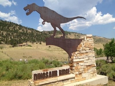 Entrance sign with part of Dinosaur Ridge in background. image. Click for full size.