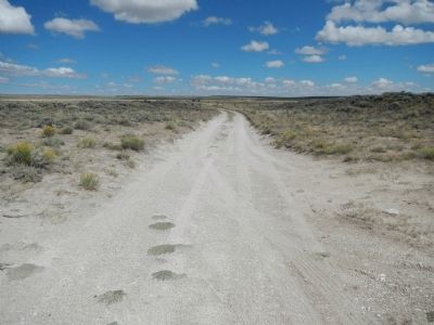 The Oregon-California Trail looking west from South Pass.. Click for full size. The Oregon-California Trail looking west from South Pass. image. Click for full size.