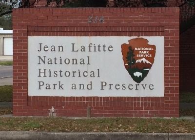 Entrance sign to Jean Lafitte National Park building. image. Click for full size.