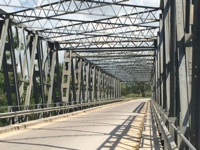 Wide view of Agripino Cawich Bridge trusswork image. Click for full size.