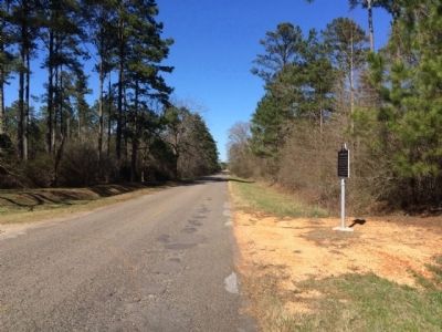 View of marker, looking north on CR-5. image. Click for full size.