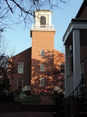 View of the church's bell tower and some of the weathered monuments in its graveyard [lower left] image. Click for full size.