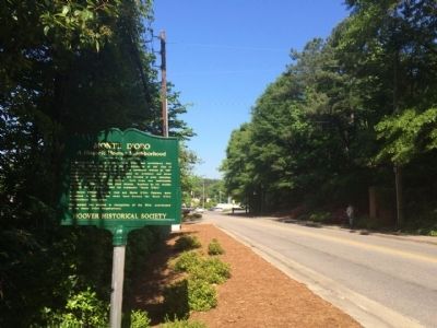 View of marker looking west on Wisteria Drive. image. Click for full size.