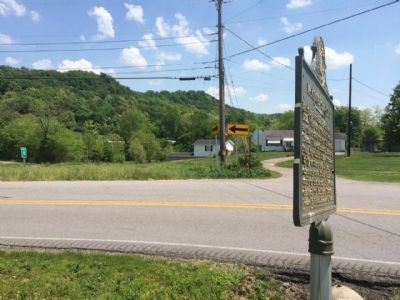 View of marker looking south down Durham Street towards cemetery location on knoll. image. Click for full size.