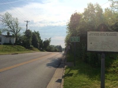 View looking east on Main Street and city limits sign. image. Click for full size.