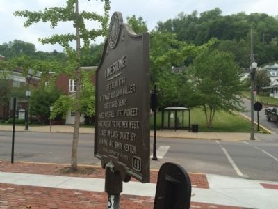 Limestone Marker at intersection looking south on Sutton Street.. Click for full size. Limestone Marker at intersection looking south on Sutton Street. image. Click for full size.