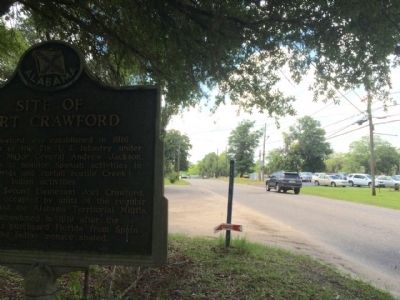 Area view of marker looking west. image. Click for full size.