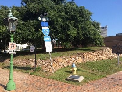 Wide area view of marker and nearby street signs. image. Click for full size.
