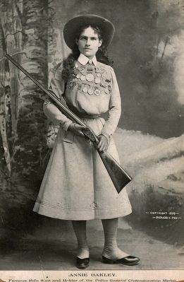<i>Annie Oakley - famous rifle shot and holder of the Police Gazette championship medal</i> image. Click for full size.