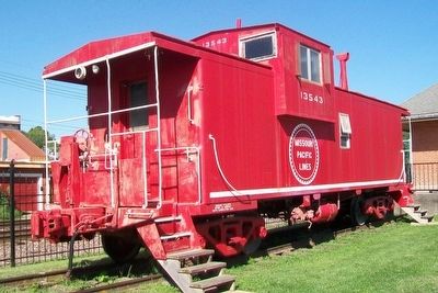 Former Missouri Pacific Railroad Caboose at Depot image. Click for full size.