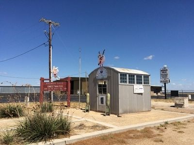 Avenger Field sign and old building image. Click for full size.