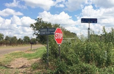Street signs showing direction to marker and cemetery. image. Click for full size.