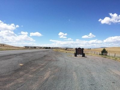 View of marker looking west on U.S. 64 towards community of Capulin. image. Click for full size.