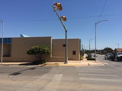 View of bank and marker looking east on 25th Street. image. Click for full size.