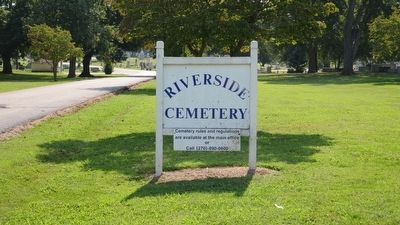 Riverside Cemetery sign nearby. image. Click for full size.