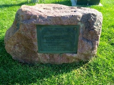 View of marker mounted to large stone near parade grounds. image. Click for full size.