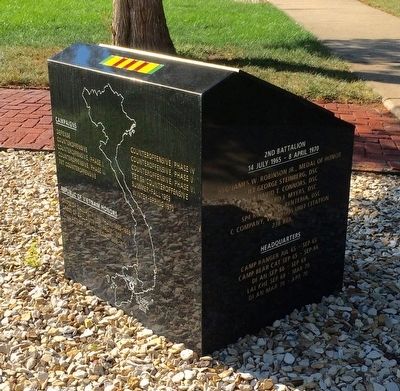 Rear of monument showing campaigns & honors<br> & side showing 2nd Battalion medals & headquarters. image. Click for full size.