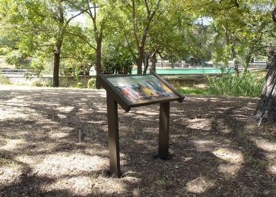 Interpretive signage with the Fort Clark post swimming pool in the distance image. Click for full size.