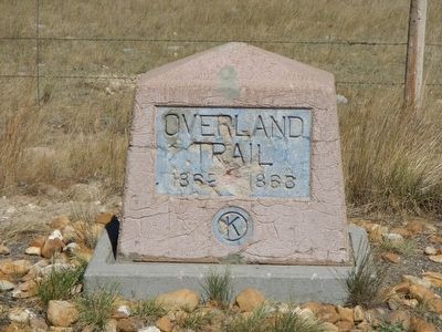 An older Overland Trail marker to the left of The Overland Trail Marker image. Click for full size.