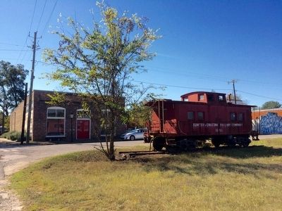 Railway caboose in front of Coleman Center image. Click for full size.