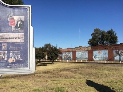 View of marker looking towards murals on Front Street.. Click for full size. View of marker looking towards murals on Front Street. image. Click for full size.