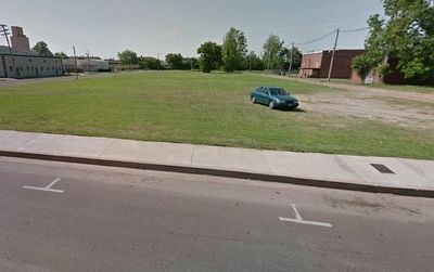 Marker on sidewalk on right & former Henry's drug store location. image. Click for full size.