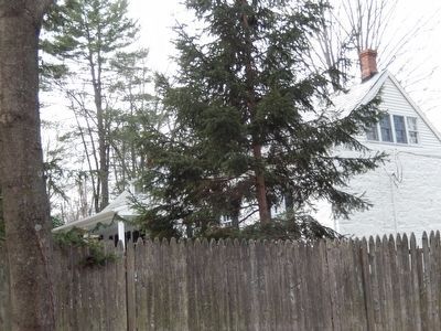 Fredericks House-side view through the privacy fence. image. Click for full size.