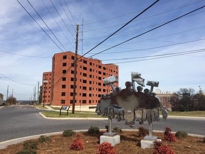 View of marker and stainless artwork showing a protest group. image. Click for full size.