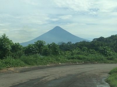 Agua Volcano, mentioned in the marker text, seen from Escuintla on the southern coast. image. Click for full size.