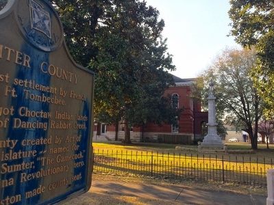 View of Confederate monument next to county courthouse. image. Click for full size.