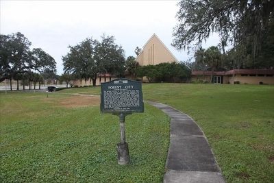 Forest City Marker with church in background image. Click for full size.