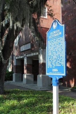 Florida Extension Marker with Rolfs Hall behind image. Click for full size.