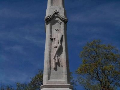 Adornments on south face of spire.. Click for full size. Adornments on south face of spire. image. Click for full size.