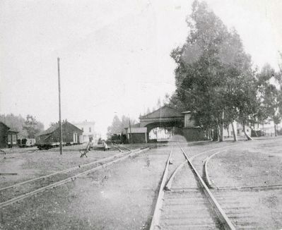Looking south from Thornton Avenue toward the South Pacific Coast RR arcade-style station.. Click for full size. Looking south from Thornton Avenue toward the South Pacific Coast RR arcade-style station. image. Click for full size.