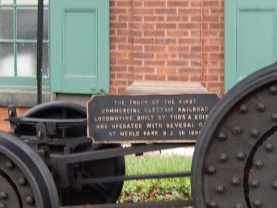 The Truck of the First Commercial Electric Railroad Locomotive. Marker image. Click for full size.