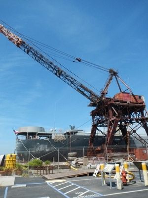 The whirley crane and S.S. Red Oak Victory in the background image. Click for full size.