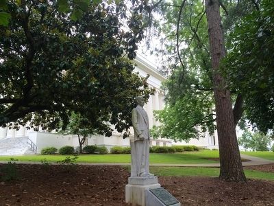Albert Patterson statue with 'Moon Tree' to right of it.. Click for full size. Albert Patterson statue with 'Moon Tree' to right of it. image. Click for full size.