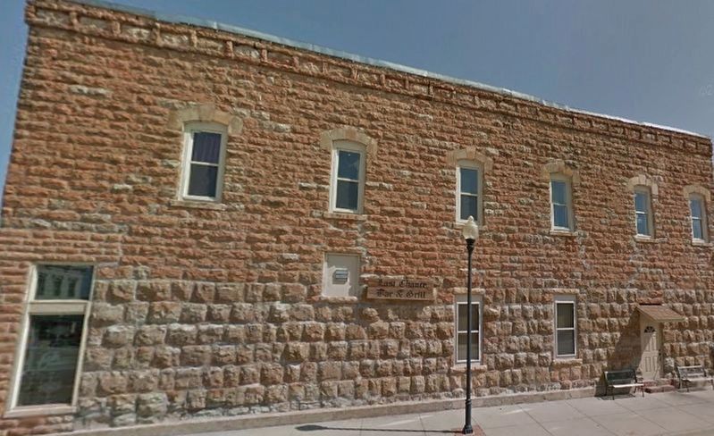 Side of Native Stone Building showing different color stone. image. Click for full size.