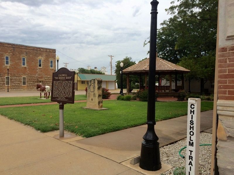 Marker view of small park and Chisholm Trail markers. image. Click for full size.