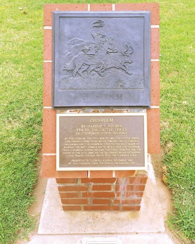 Chisholm Marker monument with cattle drive relief. image. Click for full size.