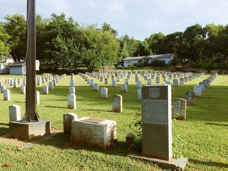 Memorial in front of Confederate grave markers. image. Click for full size.