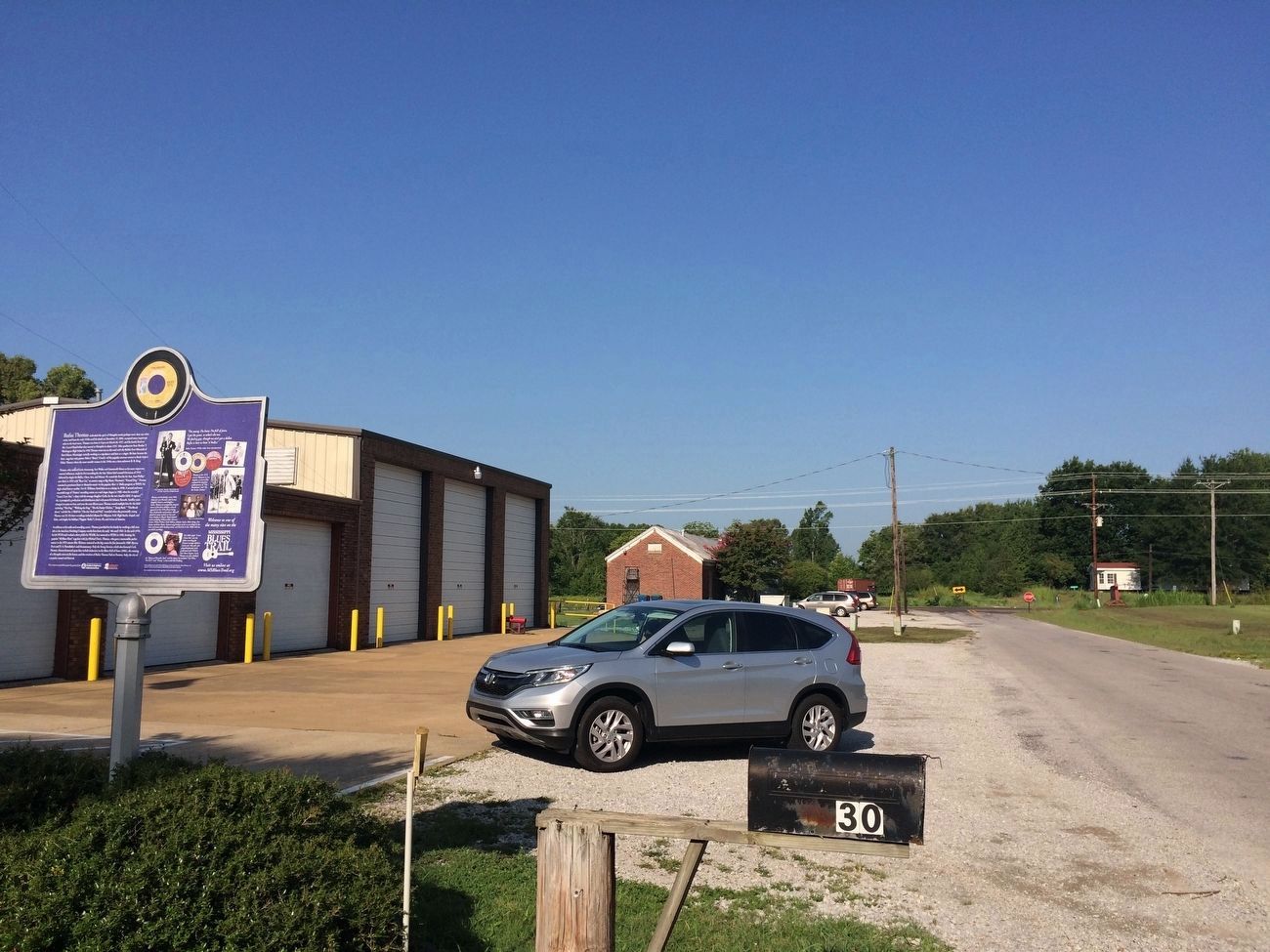 View of marker in front of fire station. image. Click for full size.
