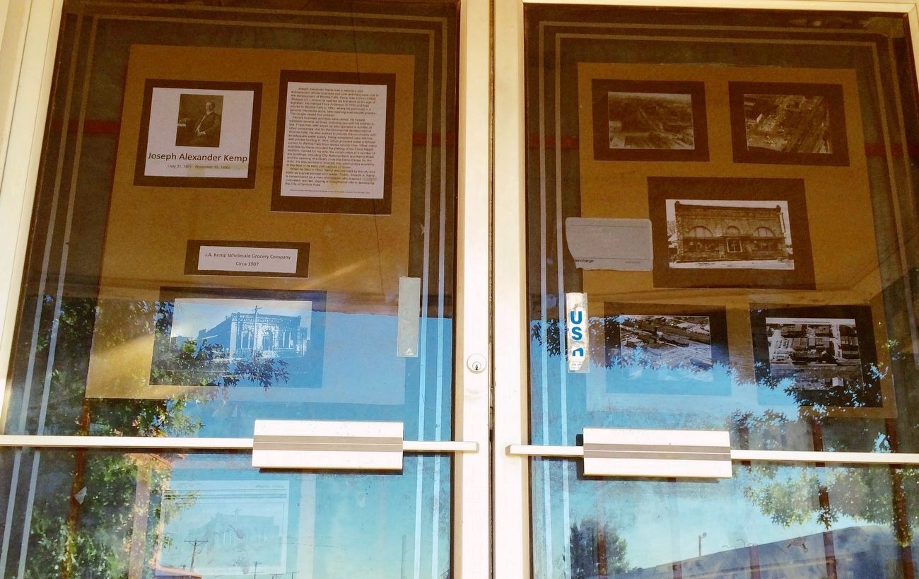 Historical photos, etc. on front doors of former Kemp Building. image. Click for full size.