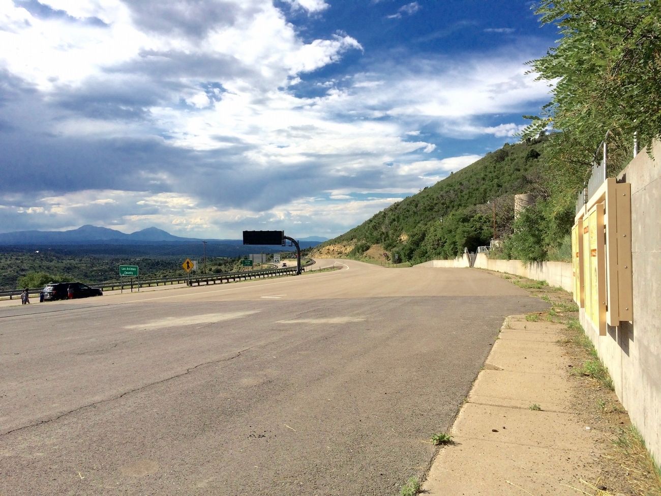 View from marker towards entrance ramp back onto I-25 in Colorado. image. Click for full size.