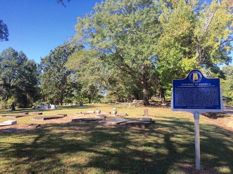 Lynching in America marker and the Rehobeth Missionary Church Cemetery. image. Click for full size.