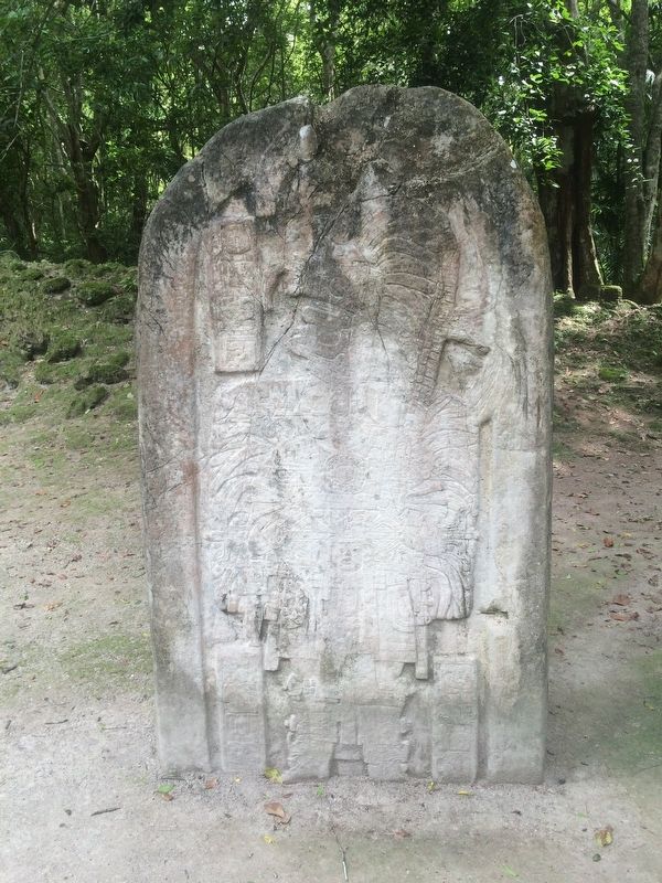 Nearby replica of Stela 16 and Jasaw Chan K'awiil. image. Click for full size.