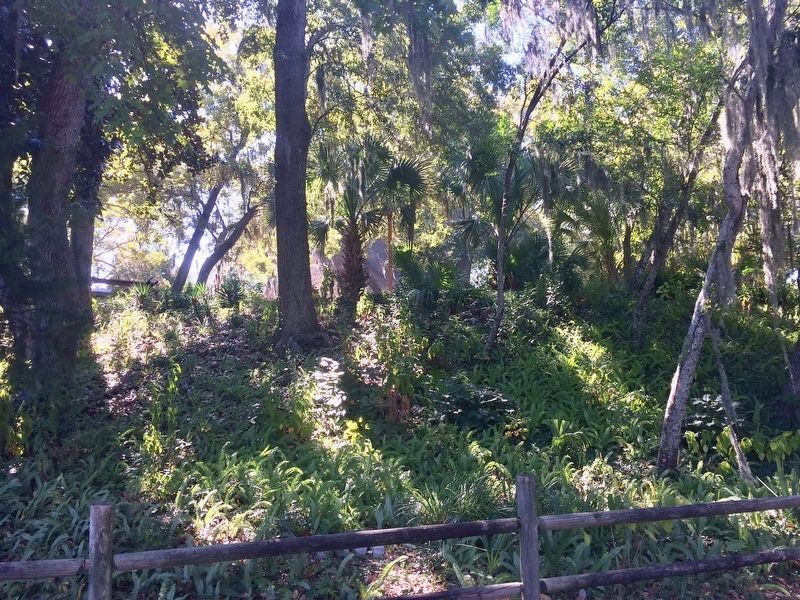 A reconstructed temple structure can just be seen atop the mound. image. Click for full size.